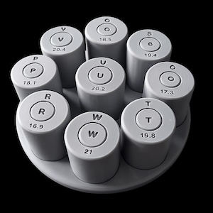 May include: A set of eight light gray cylindrical objects arranged in a circular pattern. Each cylinder has a circular top with a letter and number, such as "V 20.4" or "S 19.4". The objects are on a light gray base.