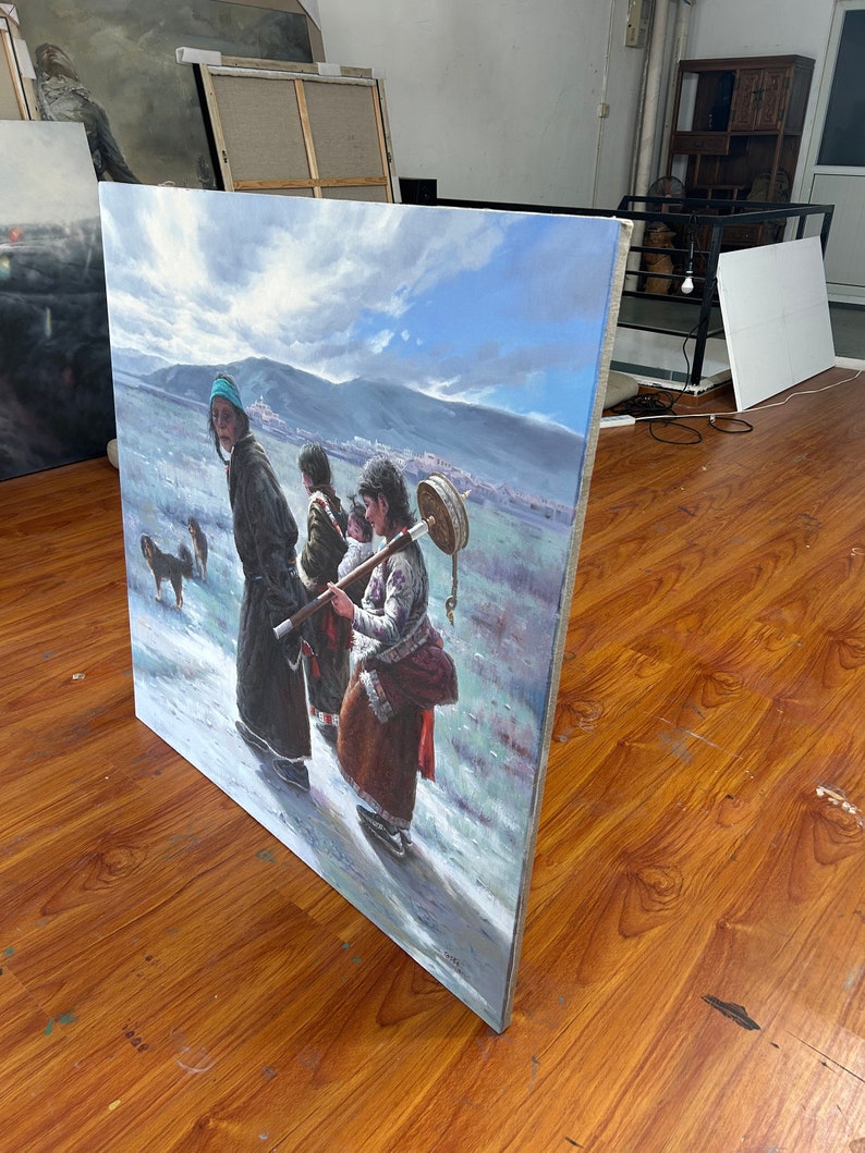 May include: A painting depicting a group of people walking in a snowy landscape. The people are wearing traditional clothing and are carrying various items. The painting is done in a realistic style and features a blue sky with white clouds.