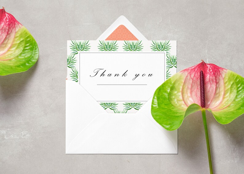 May include: A white envelope with a thank you card inside. The card has a green and white tropical leaf pattern border. Two pink and green anthurium flowers are on either side of the envelope.
