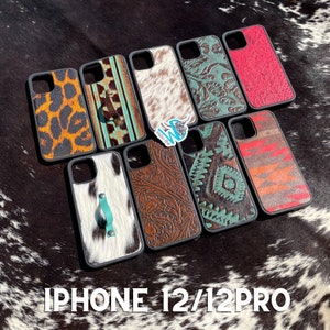 May include: Assortment of iPhone 12/12 Pro phone cases with various designs, including cowhide, paisley, and geometric patterns. The cases are black with a turquoise accent.