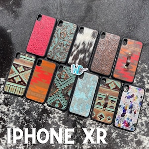 May include: An assortment of iPhone XR phone cases with various patterns and designs. The cases feature a variety of colours, including turquoise, red, brown, black, and white. The cases are made of leather and have a variety of textures, including smooth, embossed, and textured.