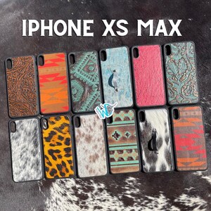May include: A collection of ten iPhone XS Max phone cases featuring a variety of designs. The cases include cowhide, leopard print, and geometric patterns. All cases are black with a clear plastic back.