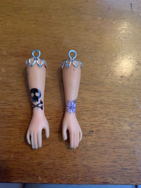 barbie arm earrings