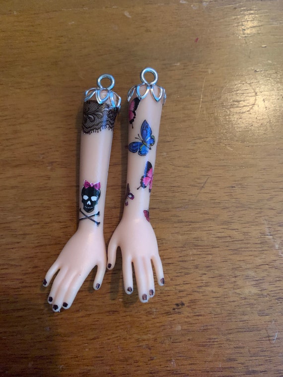 barbie arm earrings
