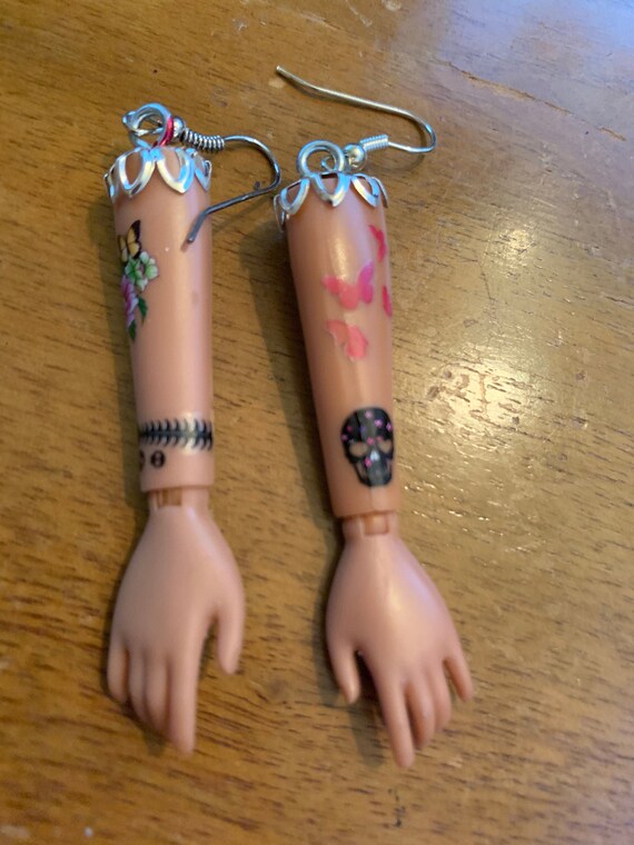 barbie arm earrings
