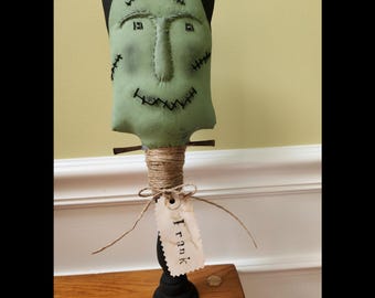 Primitive Frankenstein on candlestick