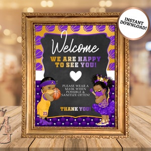May include: Welcome sign with a purple and gold basketball theme. It features two cartoon children wearing masks and holding basketballs. The sign says "Welcome, We are happy to see you!" and "Please wear a mask when possible & sanitize often! Thank you!"