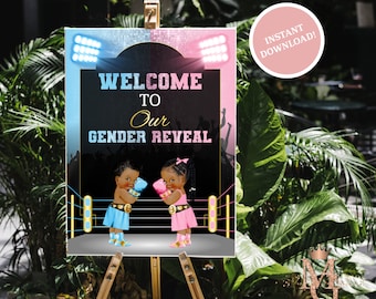 May include: A black and gold welcome sign with a boxing ring theme. The sign says "Welcome to Our Gender Reveal" with a blue and pink boxing glove on each side. The sign is 18x24 inches.