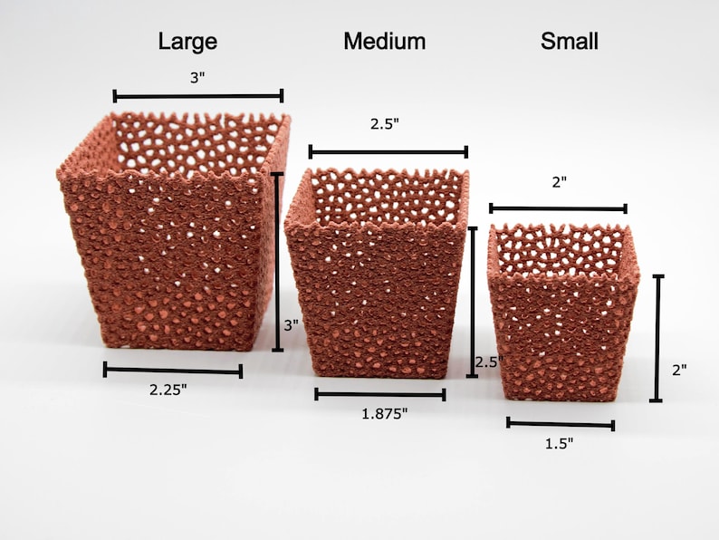 May include: Three terracotta-colored, square-shaped planters of varying sizes. The largest is 3 inches tall, 3 inches wide, and 2.25 inches deep. The medium planter is 3 inches tall, 2.5 inches wide, and 1.875 inches deep. The smallest is 2 inches tall, 2 inches wide, and 1.5 inches deep.