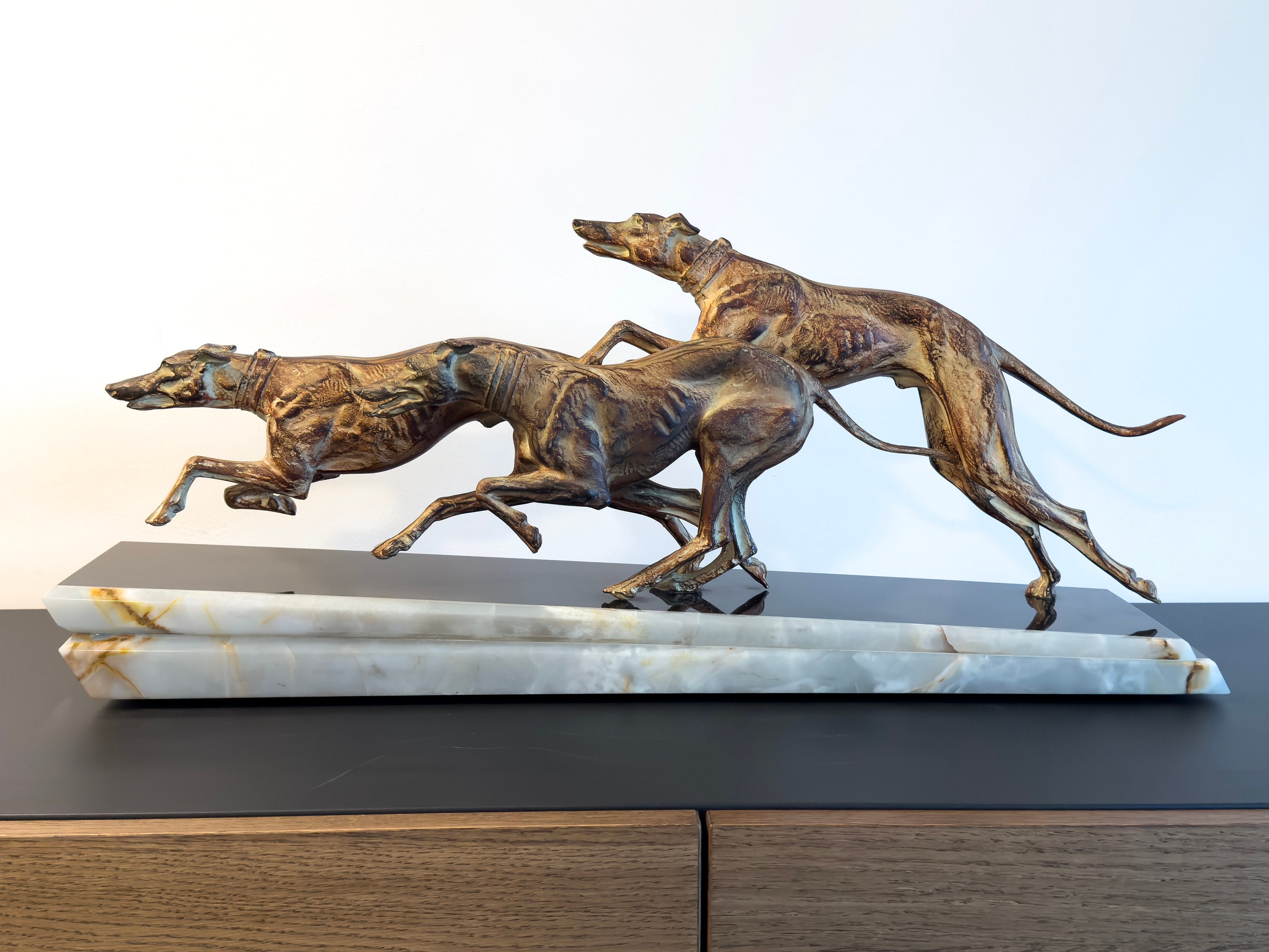 Elegant Art Deco Sculpture of Three Greyhounds in Motion A Rare 1930s  Collectible 