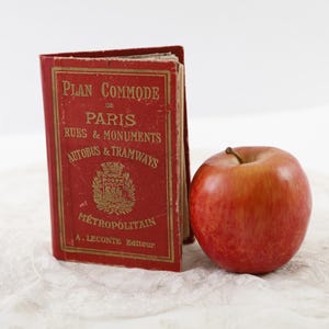 Ein LECONTE-Führer zeigt die Straßen von Paris und eine Karte mit allen Denkmälern entlang der Stationen des Metropolitan-Stadtführers aus den frühen 1900er Jahren