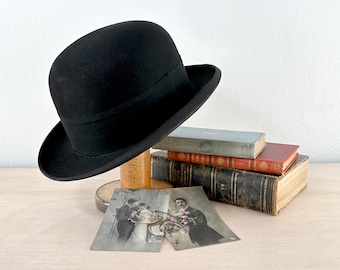 Black bowler hat, made in New York, also known as a billycock, bob hat, bombín, derby, hard felt hat, worn by Stan Laurel, Charlie Chaplin
