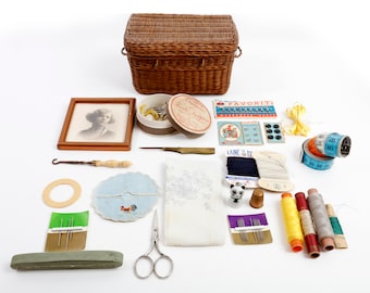 Small basket with sewing tools and a small picture in a frame, a cute kitten thimble, vintage powder box etc