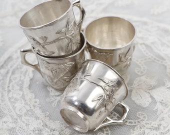 A set of 4 late 19th / early 20th century Chinese export silver cups with applied bamboo plants and birds, Chinese hallmarks