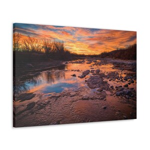 Captivating Colorado Sunset: Vibrant Hues and River Reflections