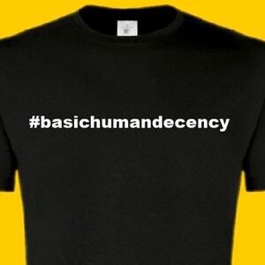 May include: Black t-shirt with white text that reads "#basichumandecency".