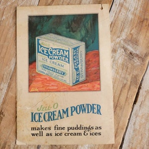 May include: Vintage Jell-O Ice Cream Powder box with a red and green background. The box is labeled "Jell-O Ice Cream Powder" and "Strawberry" with a net weight of 1 oz. The text "makes fine puddings as well as ice cream & ices" is printed below the box.