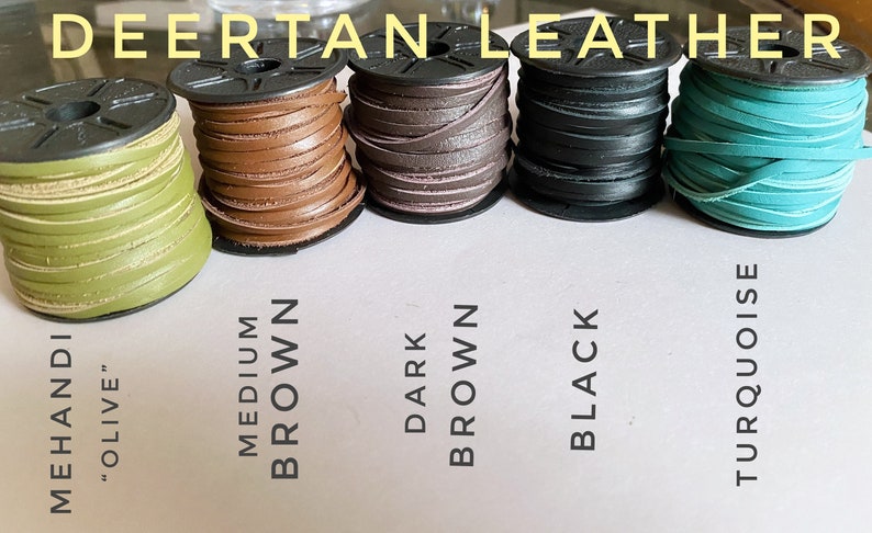 May include: Five spools of leather cord in different colors: olive green, medium brown, dark brown, black, and turquoise. The spools are labeled with the color names.
