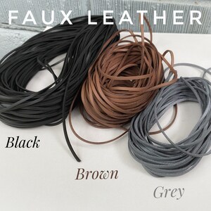 May include: Three spools of faux leather cord in black, brown, and gray. The spools are labeled "Black", "Brown", and "Grey".