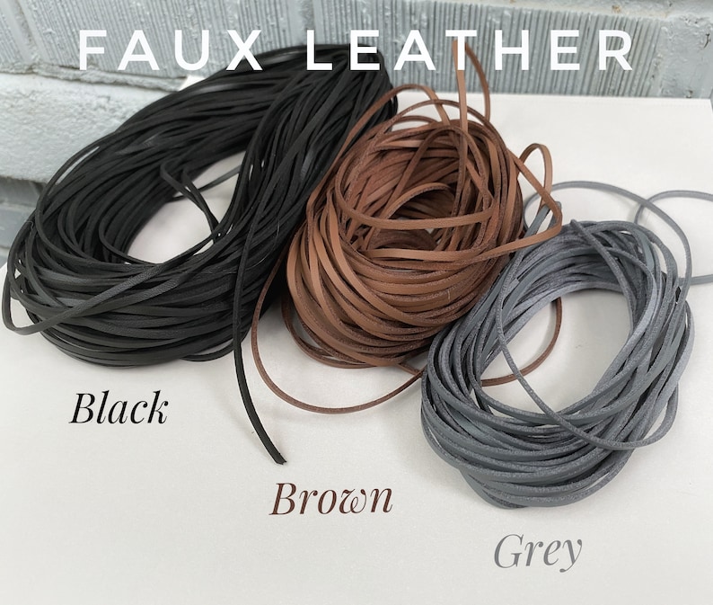 May include: Three spools of faux leather cord in black, brown, and gray. The spools are labeled "Black", "Brown", and "Grey".