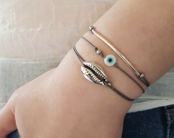 Seashell bracelet Silver sea shell bracelet Cowrie shell bracelet Seashell silver bracelet Cowrie shell jewelry Beach bracelet Cord bracelet