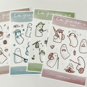 May include: Four sticker sheets featuring cute ghost illustrations. Each sheet has a different theme: autumn, winter, spring, and summer. The ghosts are depicted doing various activities, such as drinking coffee, building a snowman, gardening, and listening to music.