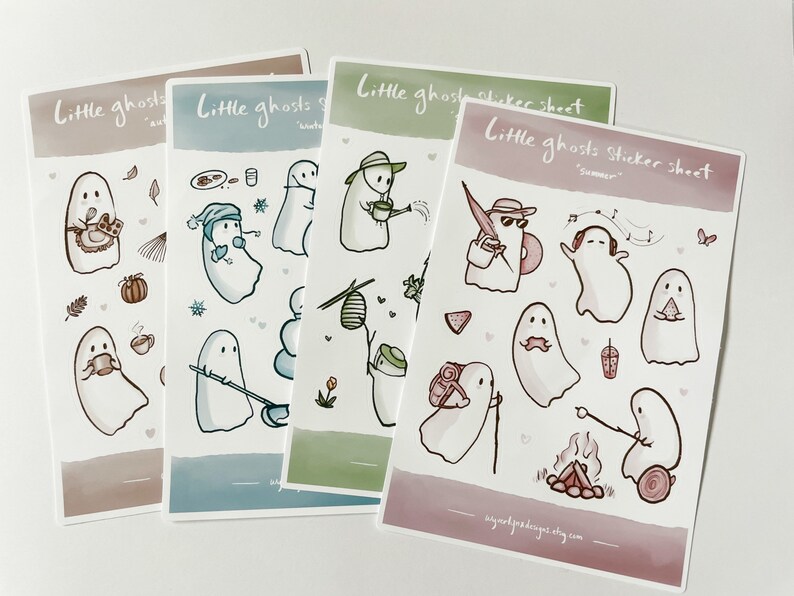May include: Four sticker sheets featuring cute ghost illustrations. Each sheet has a different theme: autumn, winter, spring, and summer. The ghosts are depicted doing various activities, such as drinking coffee, building a snowman, gardening, and listening to music.