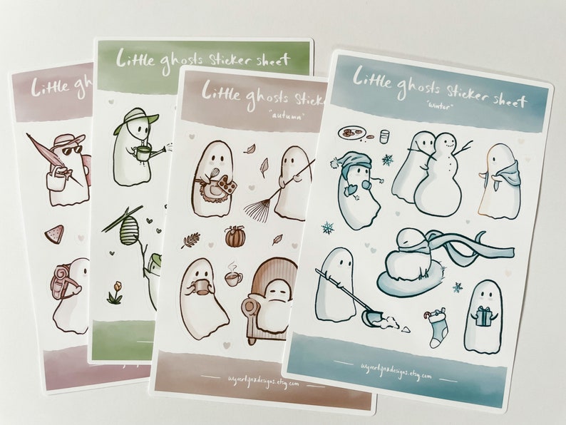 May include: Three sticker sheets featuring cute ghost illustrations. Each sheet has a different theme: autumn, winter, and a general ghost theme. The stickers are printed on white paper with a watercolor background.