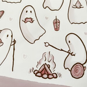May include: A set of cute ghost stickers with different activities, including hiking, eating watermelon, roasting marshmallows, and drinking boba tea. The stickers are in a watercolor style with pink and brown accents.