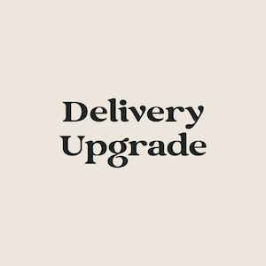 May include: Delivery Upgrade text in black bold font on a light beige background.
