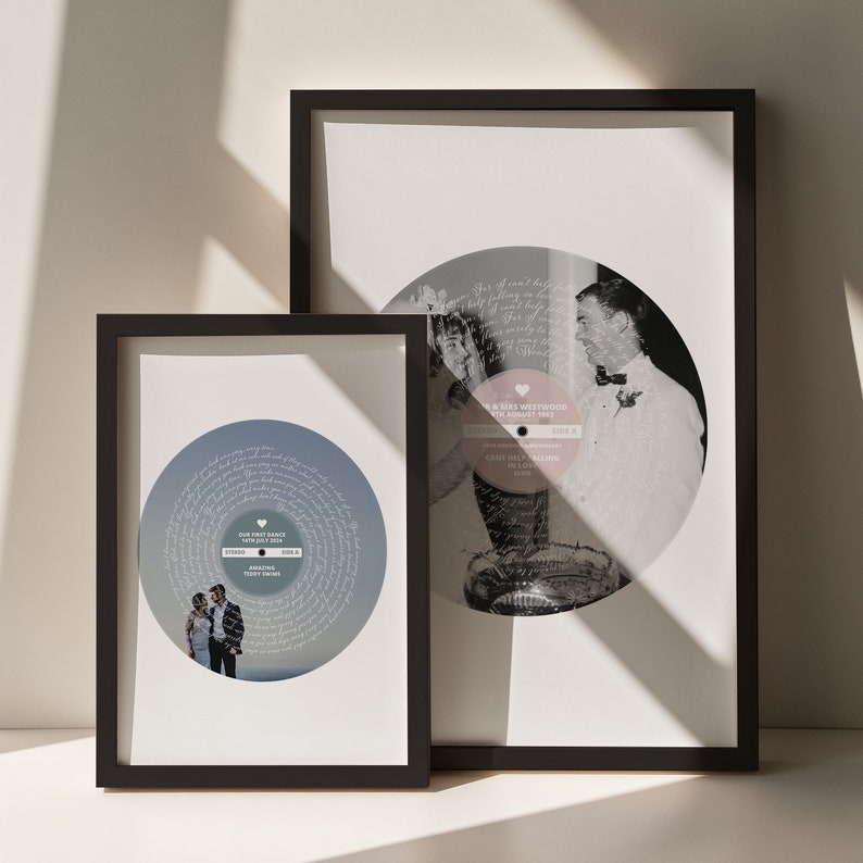 May include: Two framed prints of wedding record designs. The first print features a black and white photo of a couple dancing with a record design in the background. The second print features a photo of a couple in front of a record design with their names and wedding date. The text on the record design reads "Our First Dance, 14th July 2023, Amazing First Dance, Side A".