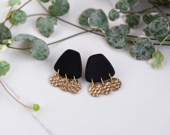 Black trapezoid earring with raw brass charms