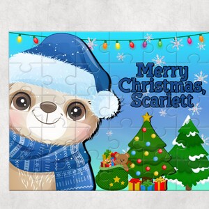 May include: A Christmas-themed puzzle featuring a cute sloth wearing a blue Santa hat and scarf. The puzzle has a blue background with snowflakes and a string of colorful lights. The text "Merry Christmas, Scarlett" is written in white letters on the puzzle.