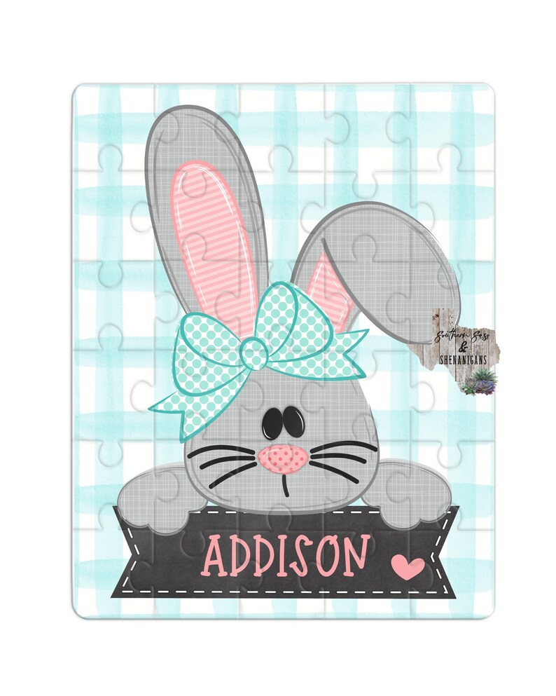 May include: A gray bunny with pink ears and a turquoise bow holding a black banner with the name Addison written in pink with a pink heart.