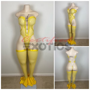 May include: Yellow fishnet bodysuit with a lace-up front and matching fishnet stockings. The bodysuit has a mermaid tail design at the bottom.