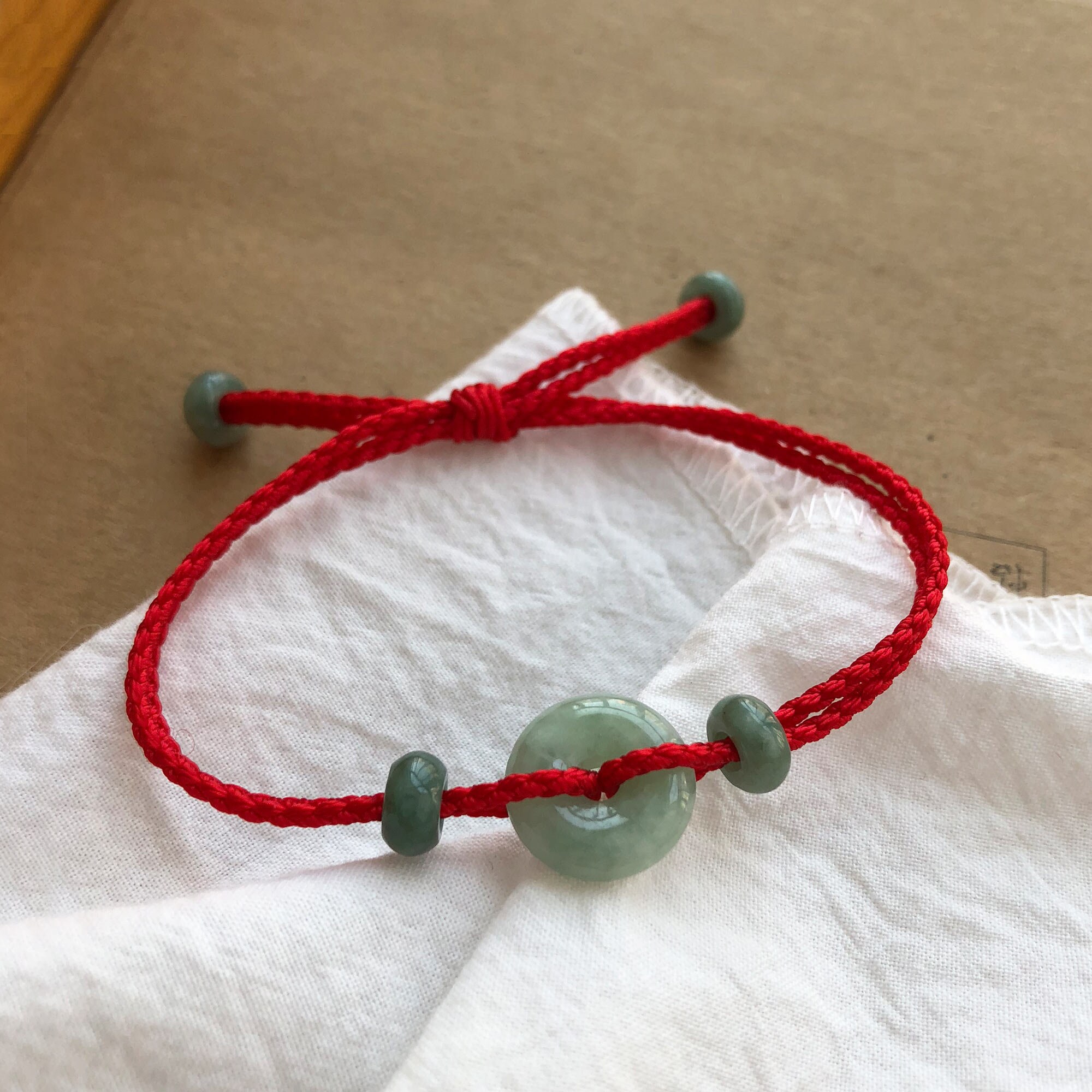 Red string jade best sale bracelet