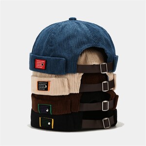 Brimless hat best sale crossword