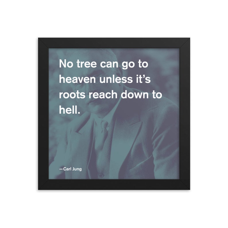 May include: A black framed print featuring a quote by Carl Jung: "No tree can go to heaven unless it's roots reach down to hell."