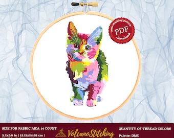May include: Cross stitch pattern PDF download for a colorful cat with a pink, green, yellow, blue, and purple design. The pattern is for Aida 14 count fabric and measures 5.2 inches by 9.8 inches (13.21 cm by 24.89 cm). It requires 26 DMC thread colors.