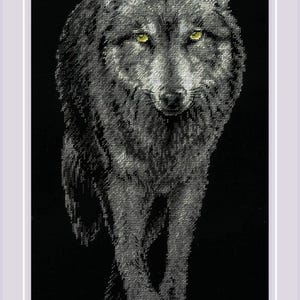 May include: A detailed cross-stitch depiction of a wolf against a black background. The wolf is rendered in shades of gray, with piercing yellow eyes. The artwork is framed in white, highlighting the intricate needlework.