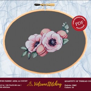 May include: Cross stitch pattern PDF download for a floral design featuring pink anemones and macarons on a gray background. The pattern is for Aida 14 count fabric and requires 25 DMC colors.