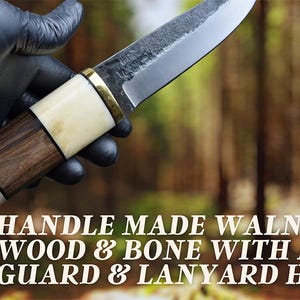 May include: A handcrafted knife with a walnut wood and bone handle, brass guard, and lanyard hole. The blade is made of steel. The text on the image reads: HANDLE MADE WALNUT WOOD & BONE WITH BRASS GUARD & LANYARD HOLE.