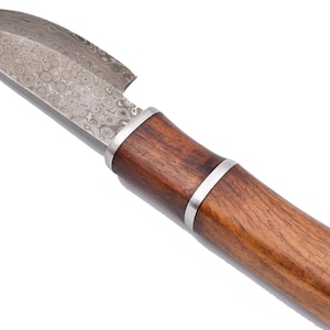 May include: A small, silver knife with a wooden handle. The blade has a patterned finish.