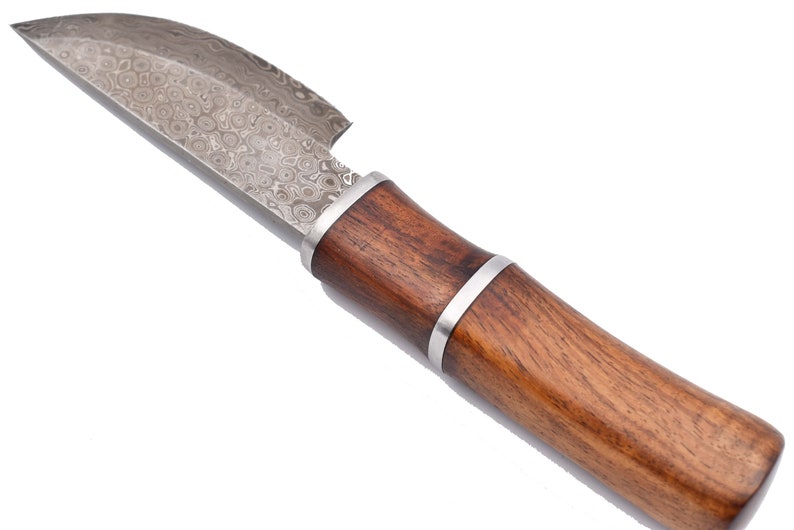 May include: A small, silver knife with a wooden handle. The blade has a patterned finish.