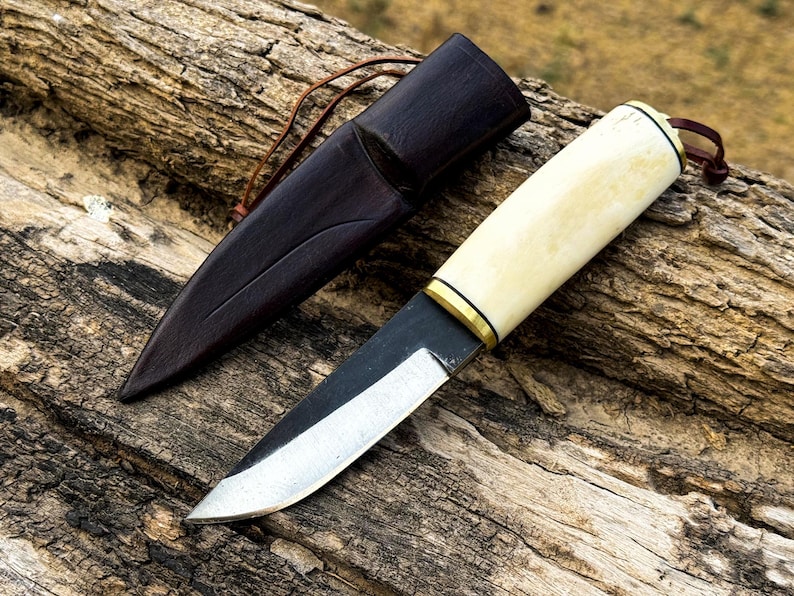 Handmade Puukko knife with high carbon steel and bone handle with leather sheath