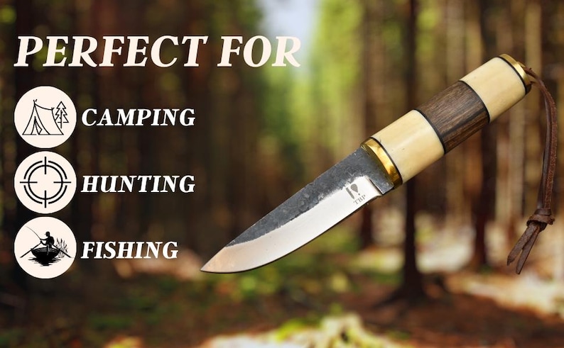 May include: A handcrafted knife with a wooden and bone handle, brass accents, and a leather lanyard. The blade is silver with a dark finish. Text on the image says "PERFECT FOR" and lists camping, hunting, and fishing.