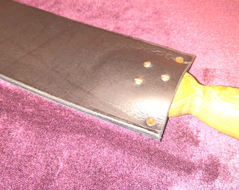 Leather paddle with carved wooden handle