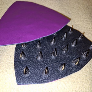Bra inserts with sophisticated metal spikes and elegant purple and black leather.