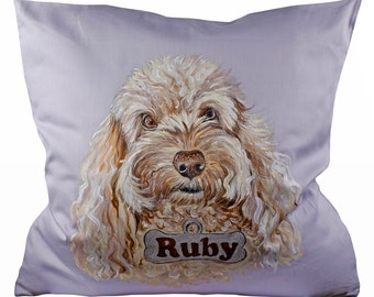 May include: A light purple pillow with a painted image of a light brown dog with a bone-shaped tag that says "Ruby".