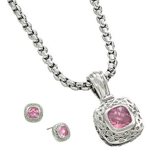 May include: A silver chain necklace with a square pendant featuring a pink gemstone. Matching square stud earrings with pink gemstones.